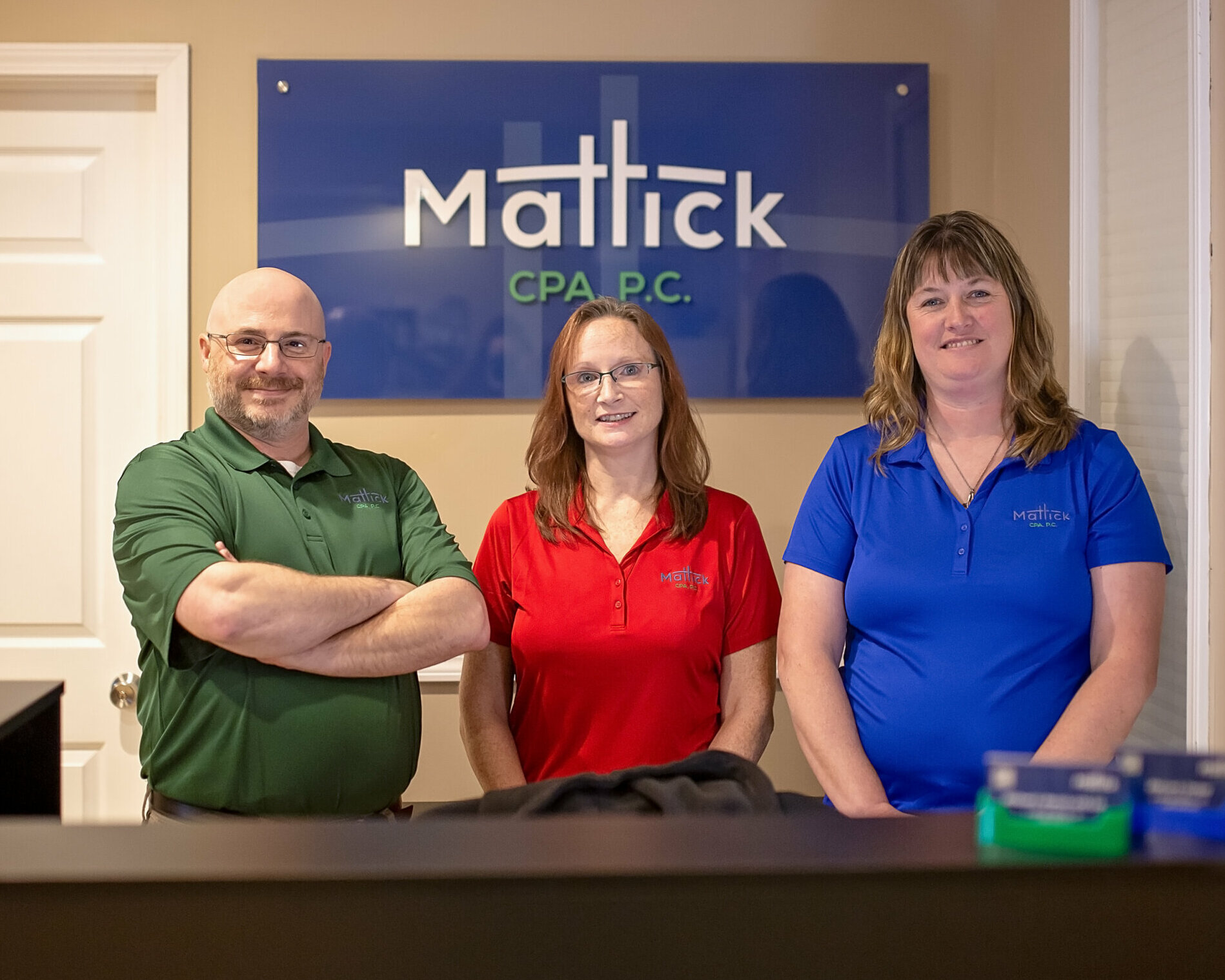 The Mattick team standing together in the office